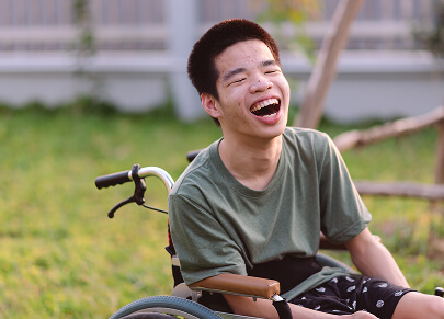 A photo of a man with cerebral palsy smiling