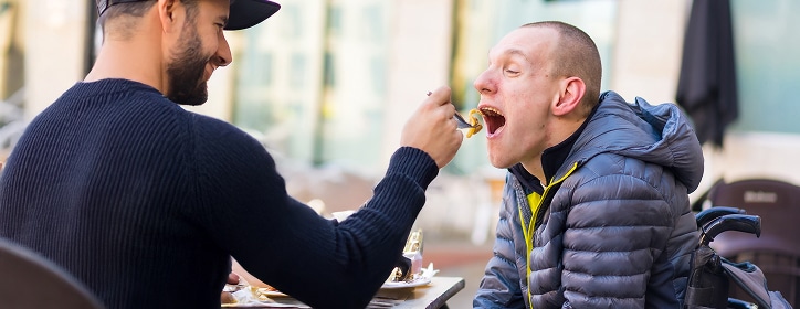 A person being assisted with eating