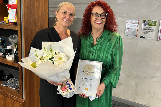 Ainslie being presented her award