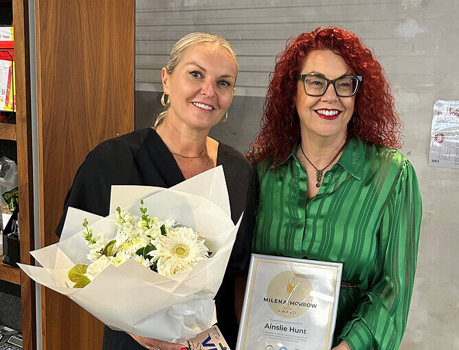 Ainslie being presented her award